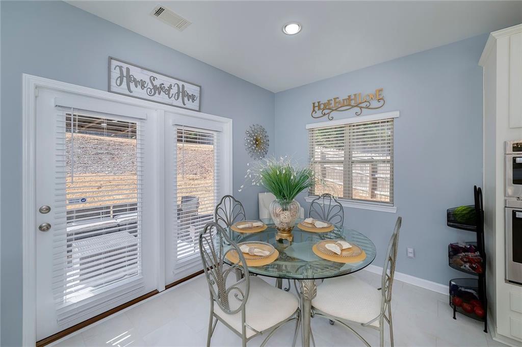 6810 Rocking Horse Lane Cumming, GA 30040 - Photo 12 of 39 a view of a dining room with furniture and window