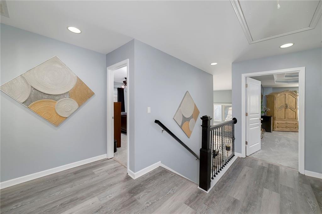 6810 Rocking Horse Lane Cumming, GA 30040 - Photo 22 of 39 a view of a hallway with staircase