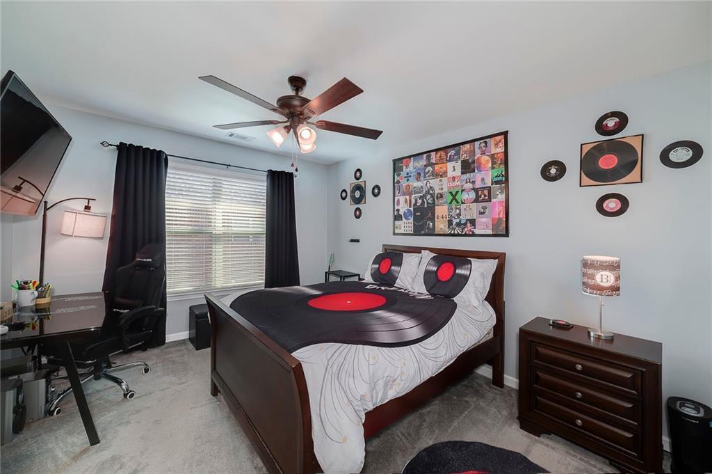 6810 Rocking Horse Lane Cumming, GA 30040 - Photo 30 of 39 a living room with furniture and a window
