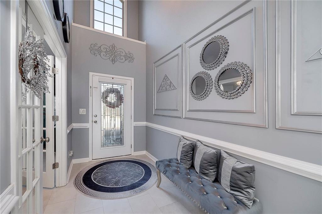 6810 Rocking Horse Lane Cumming, GA 30040 - Photo 3 of 39 a bathroom with a sink a mirror and vanity