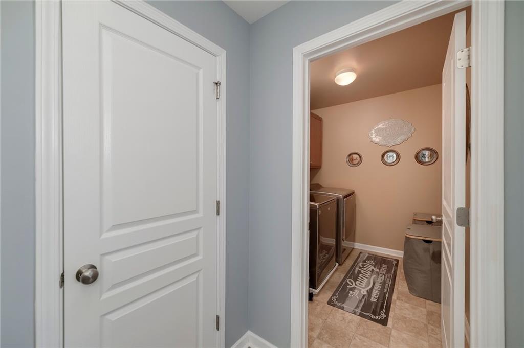 6810 Rocking Horse Lane Cumming, GA 30040 - Photo 35 of 39 a bathroom with a sink and toilet