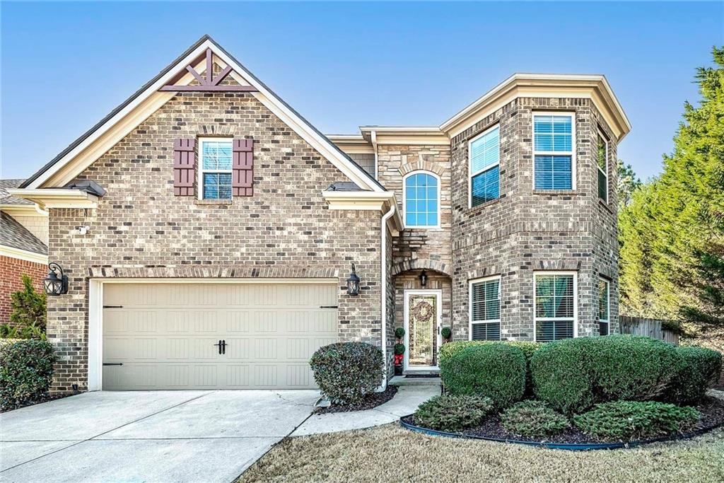 6810 Rocking Horse Lane Cumming, GA 30040 - Photo 36 of 39 a front view of a house