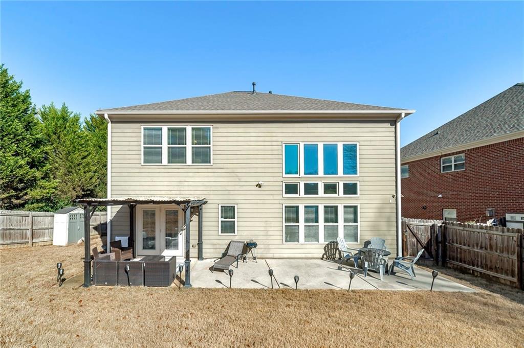 6810 Rocking Horse Lane Cumming, GA 30040 - Photo 37 of 39 a front view of a house with patio