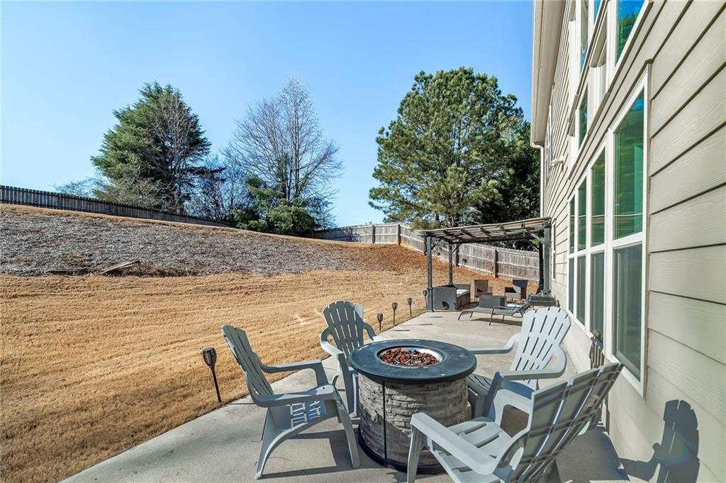 6810 Rocking Horse Lane Cumming, GA 30040 - Photo 38 of 39 a view of a chairs and table in the patio
