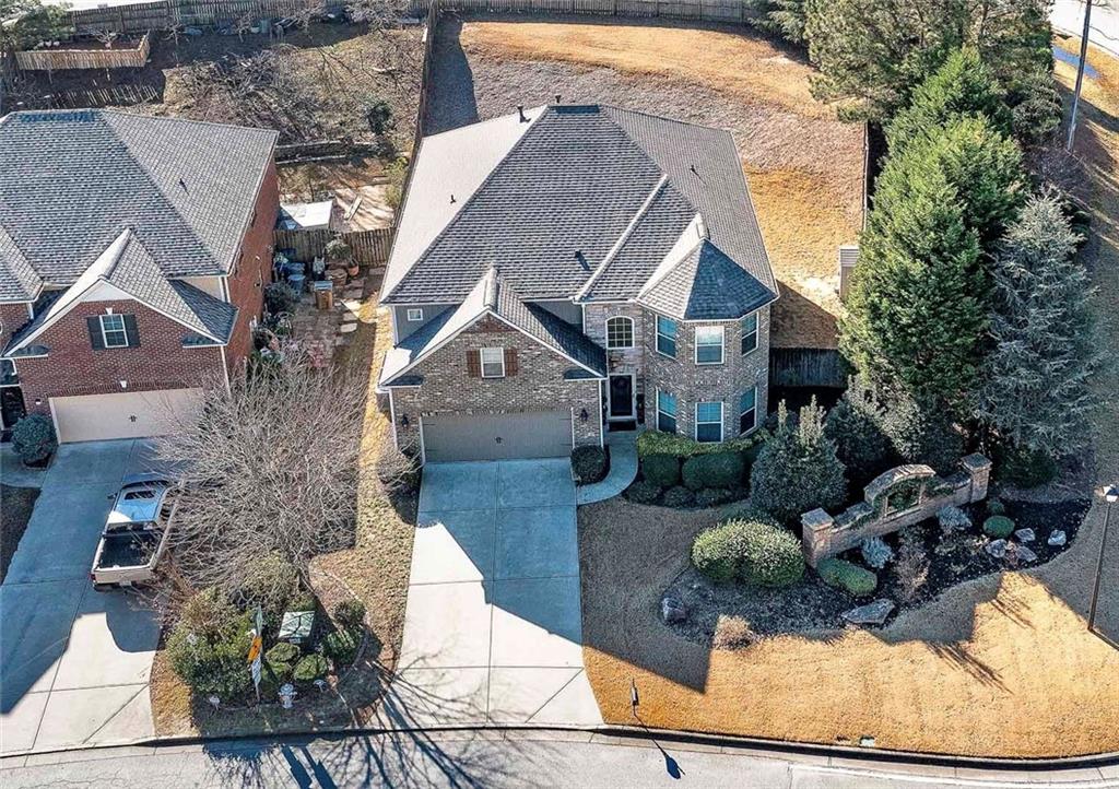 6810 Rocking Horse Lane Cumming, GA 30040 - Photo 39 of 39 a front view of a house with garden