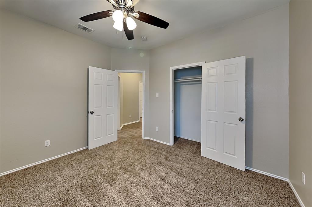 7016 Raintree Way Denton, TX 76210 - Photo 13 of 18 a view of an empty room and chandelier fan