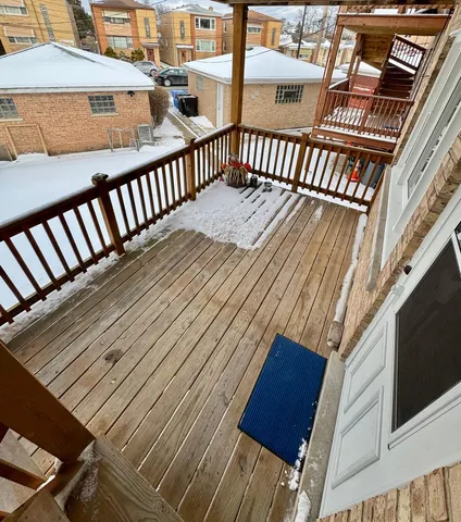 a view of a balcony with wooden floor