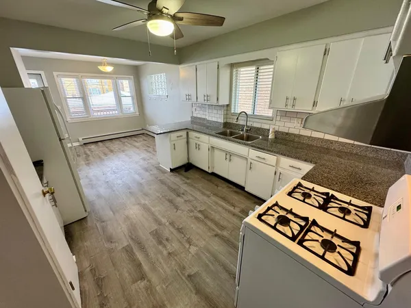 a kitchen with a stove and a sink