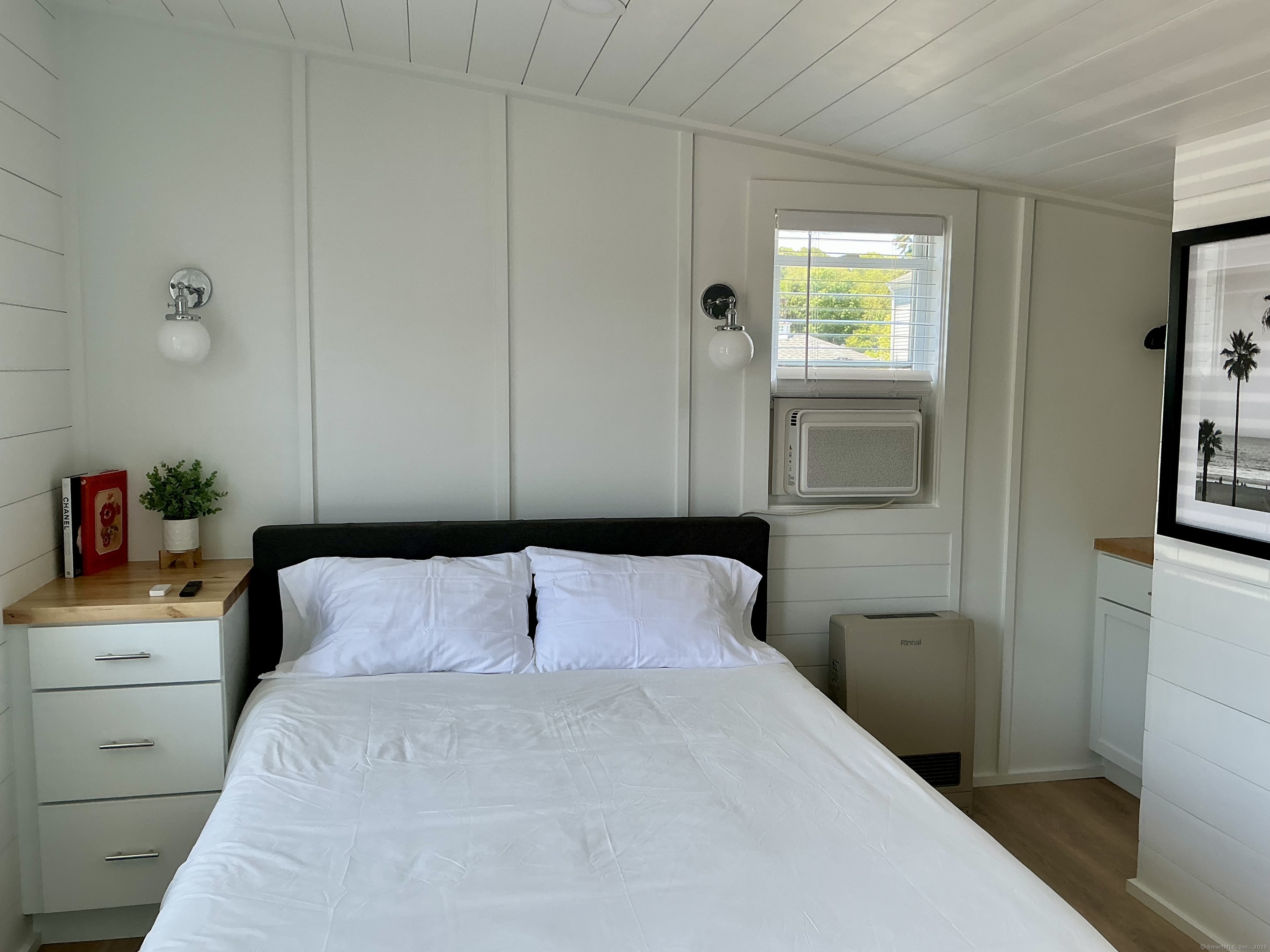 901 Stonington Road Stonington, CT 06379 - Photo 2 of 6 a bedroom with a bed and a window