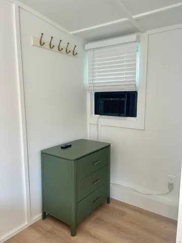 a bathroom with a shower and a sink