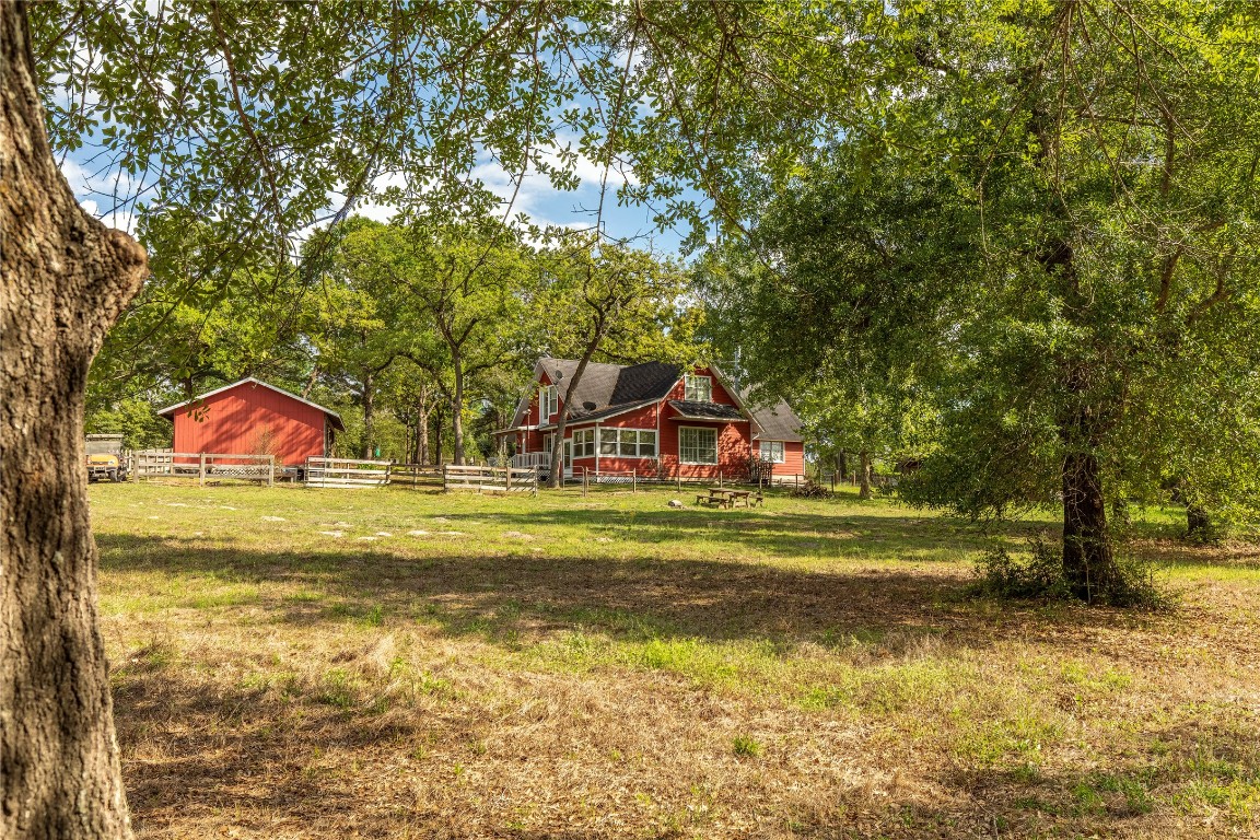 636 Deer Run Road Bellville, TX 77418 - Photo 20 of 23 a front view of a house with a big yard