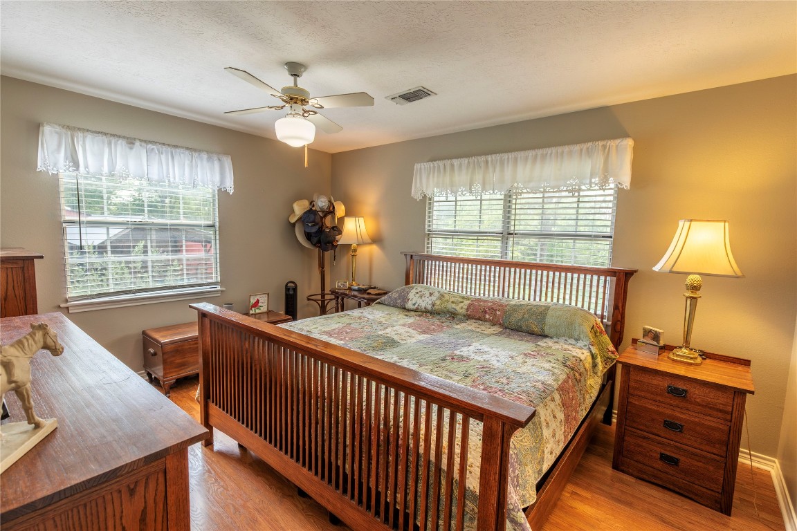 636 Deer Run Road Bellville, TX 77418 - Photo 5 of 23 a bedroom with a bed and a table in it