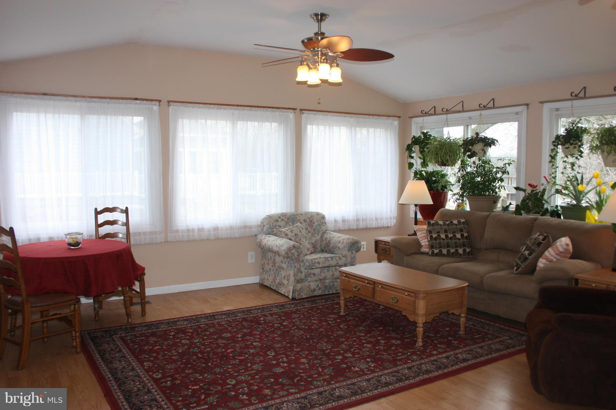 1563 Bollinger Road Westminster, MD 21157 - Photo 14 of 24 WINDOWS WRAP AROUND THIS BRIGHT FAMILY AREA