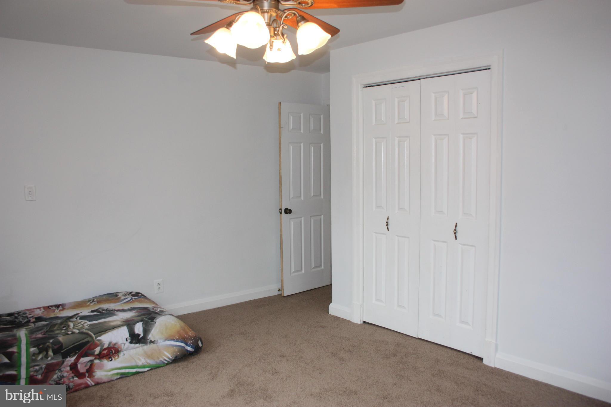 1563 Bollinger Road Westminster, MD 21157 - Photo 18 of 24 SIX-PANEL DOORS AND CEILING FAN
