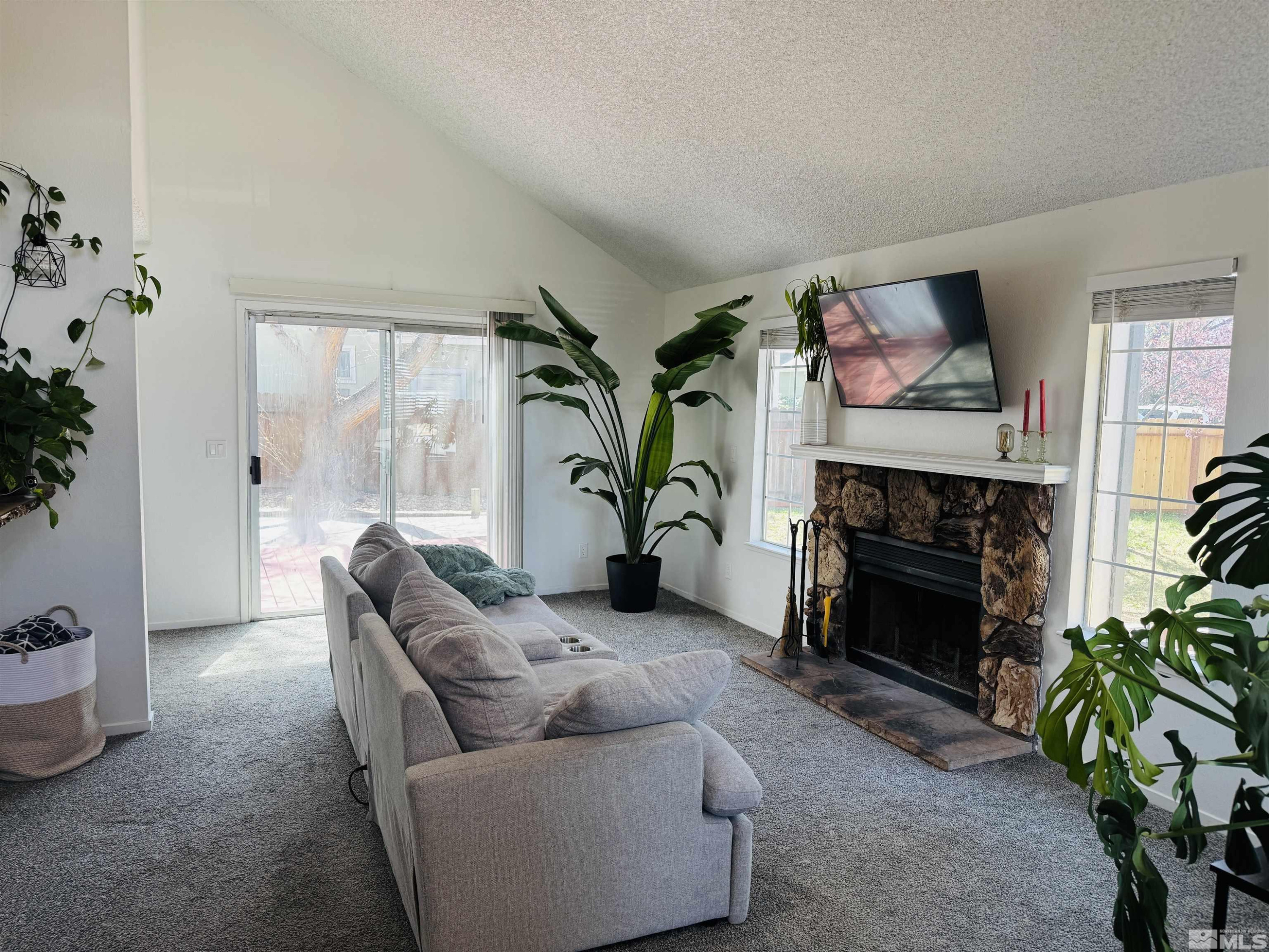 4360 Perro Lane Reno, NV 89502 - Photo 3 of 27 a living room with furniture and a fireplace