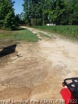 415 Atkinson Road Orrum, NC 28369 - Photo 11 of 17 a view of a golf course with a yard