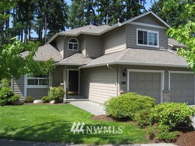 20032 34th Avenue Southeast Bothell, WA 98012 - Photo 1 of 1 a front view of a house with garden
