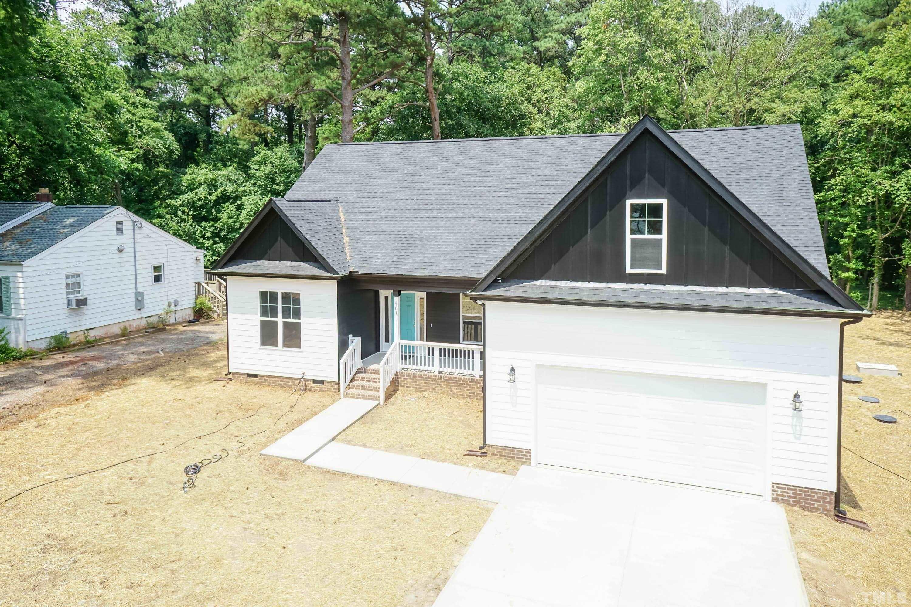 1701 Honeysuckle Road Raleigh, NC 27609 - Photo 1 of 29 a house view with a outdoor space