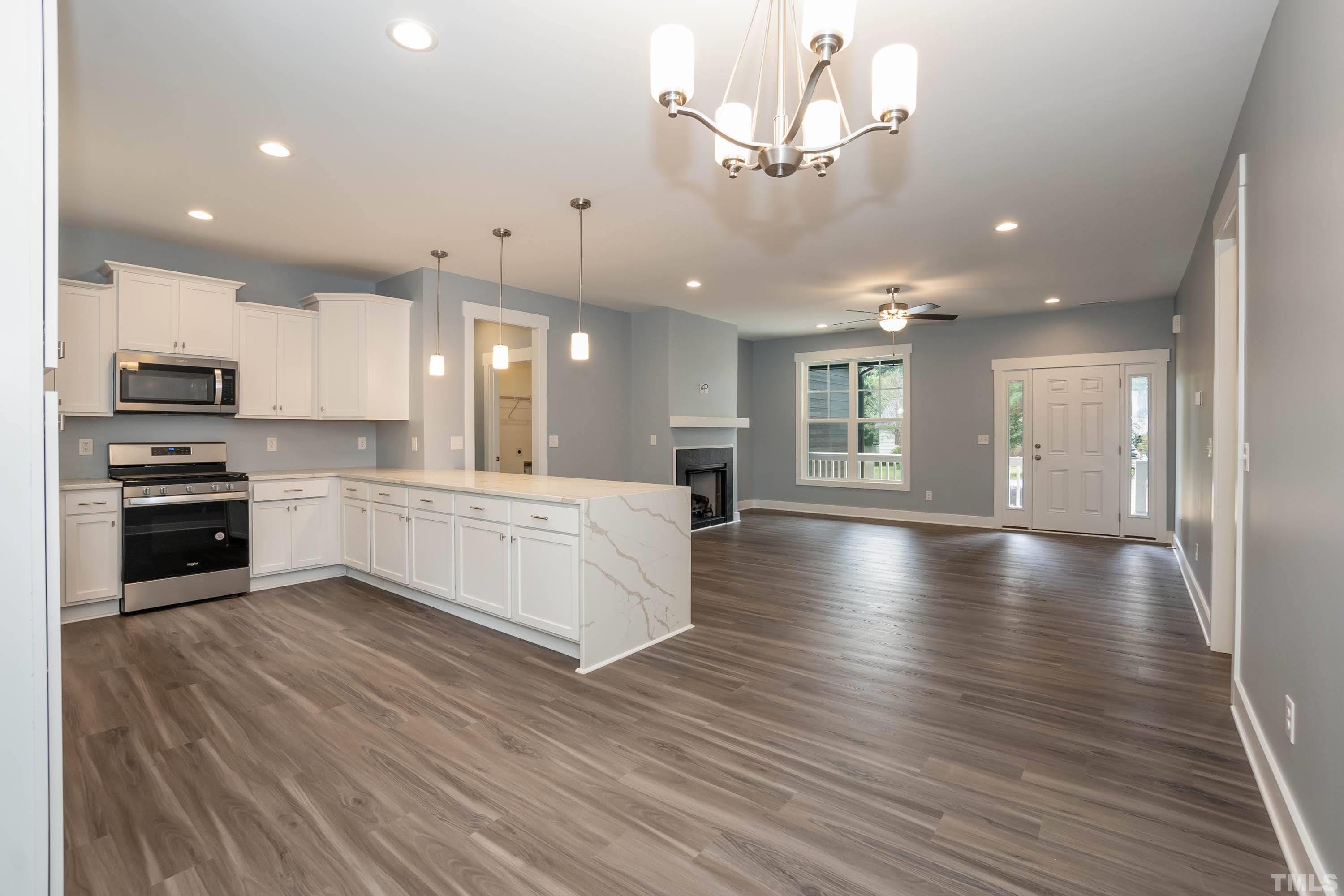 1701 Honeysuckle Road Raleigh, NC 27609 - Photo 12 of 29 a view of a kitchen with a sink and microwave