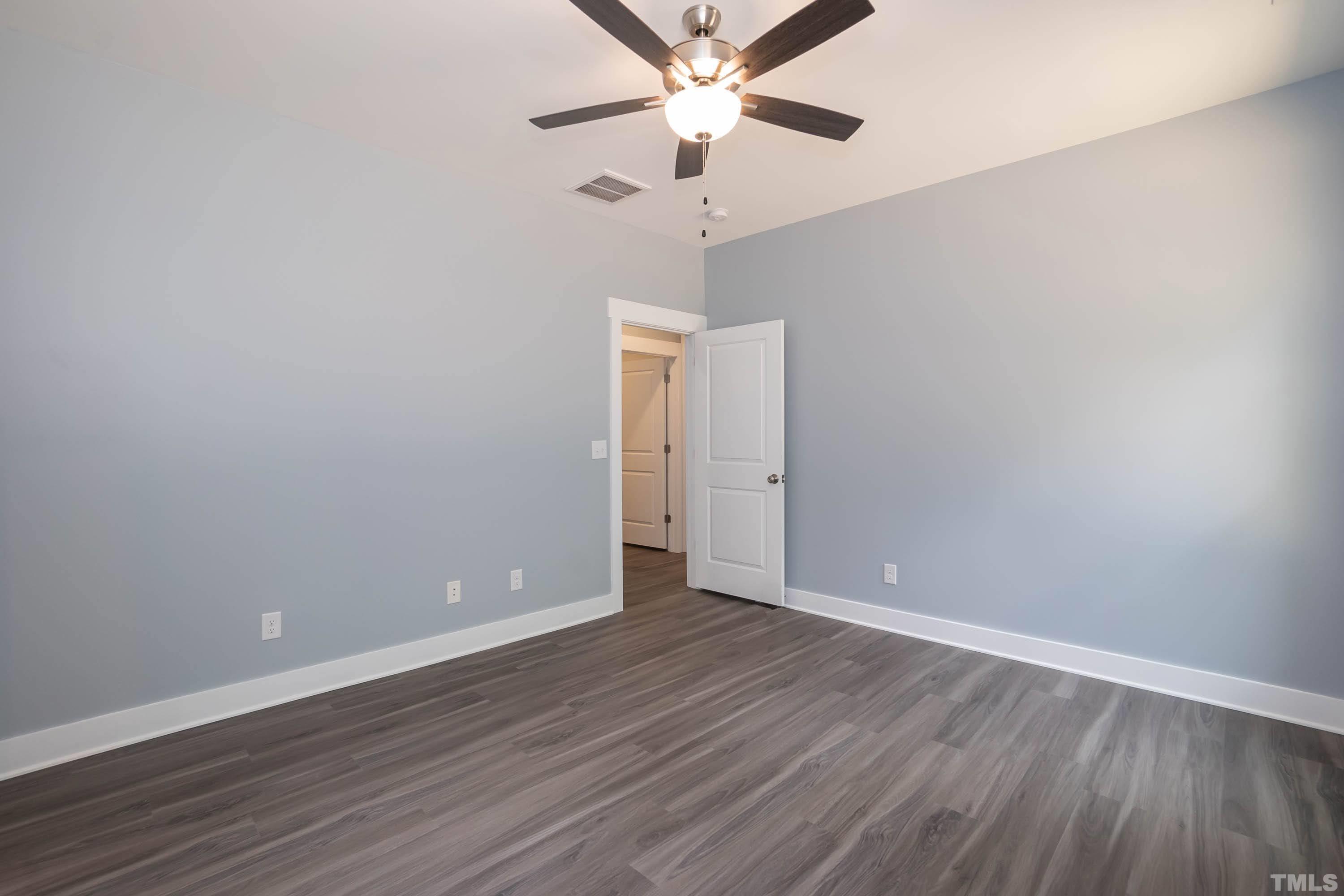 1701 Honeysuckle Road Raleigh, NC 27609 - Photo 14 of 29 a view of an empty room with wooden floor