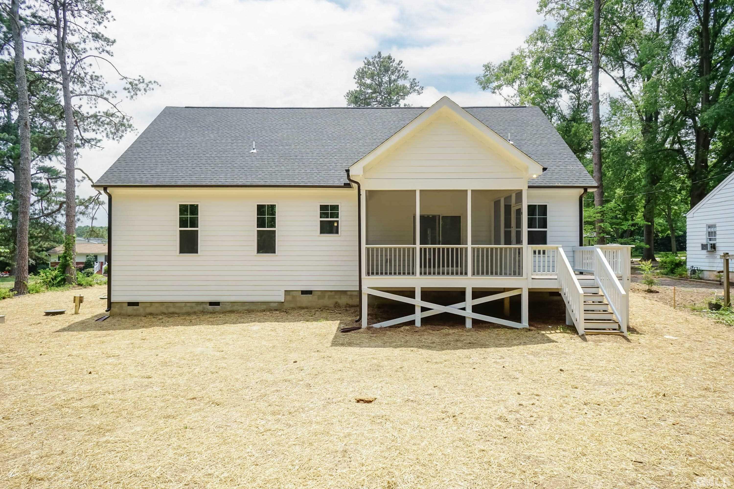 1701 Honeysuckle Road Raleigh, NC 27609 - Photo 26 of 29 a view of a house with a yard and sitting area