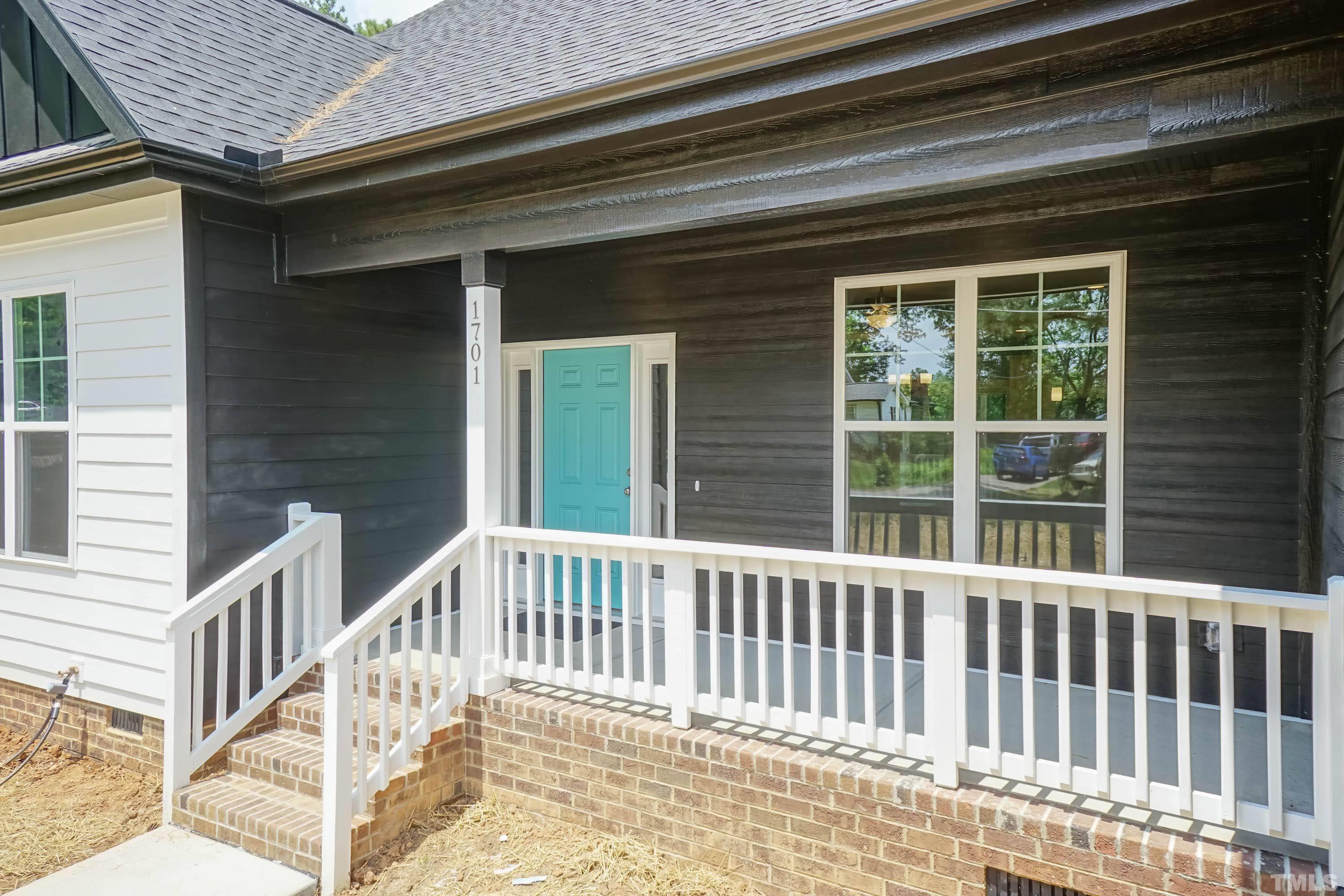1701 Honeysuckle Road Raleigh, NC 27609 - Photo 3 of 29 a view of a brick house with a window