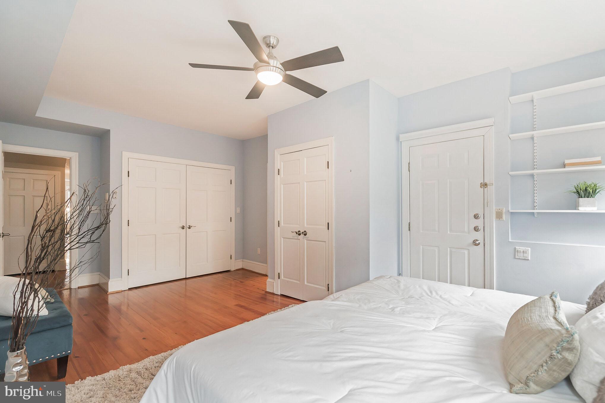 1754 Willard Street Northwest, Unit 2 Washington, DC 20009 - Photo 11 of 28 a bedroom with a large bed and wooden floor