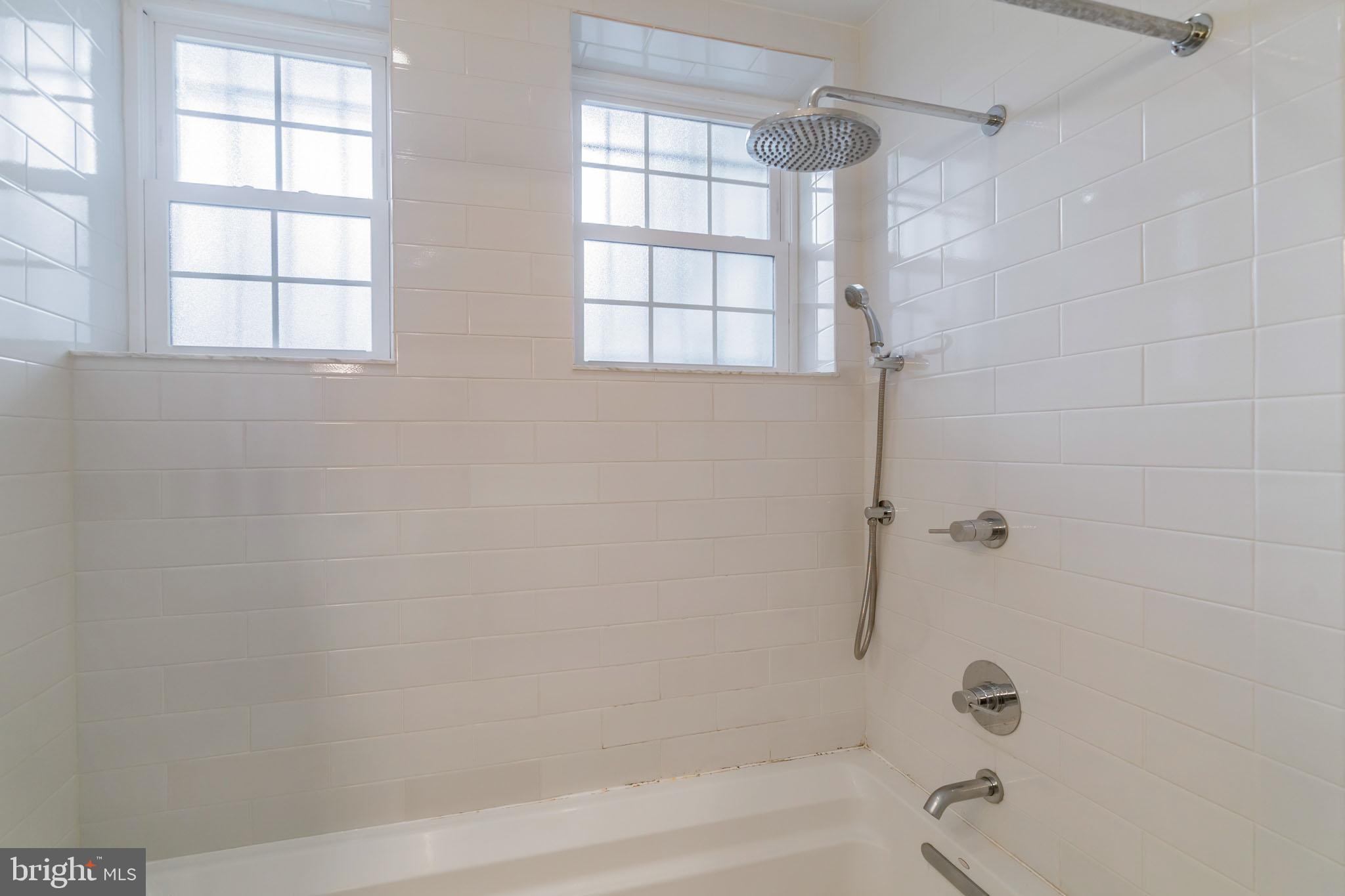 1754 Willard Street Northwest, Unit 2 Washington, DC 20009 - Photo 13 of 28 a bathroom with a bathtub and shower
