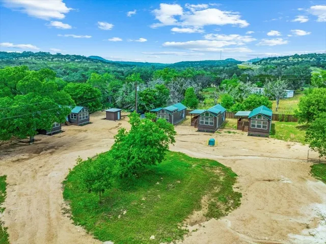 a view of a garden with lawn chairs