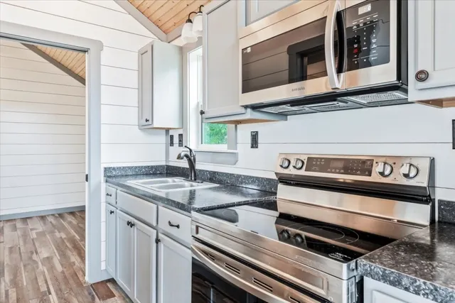 a kitchen with a stove and a microwave