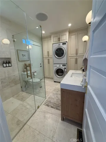 a spacious bathroom with a tub sink mirror and shower