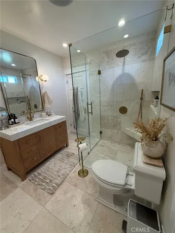 a bedroom with a bed chair and window