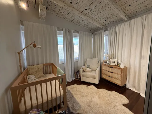 a bathroom with a sink a granite countertop and a mirror