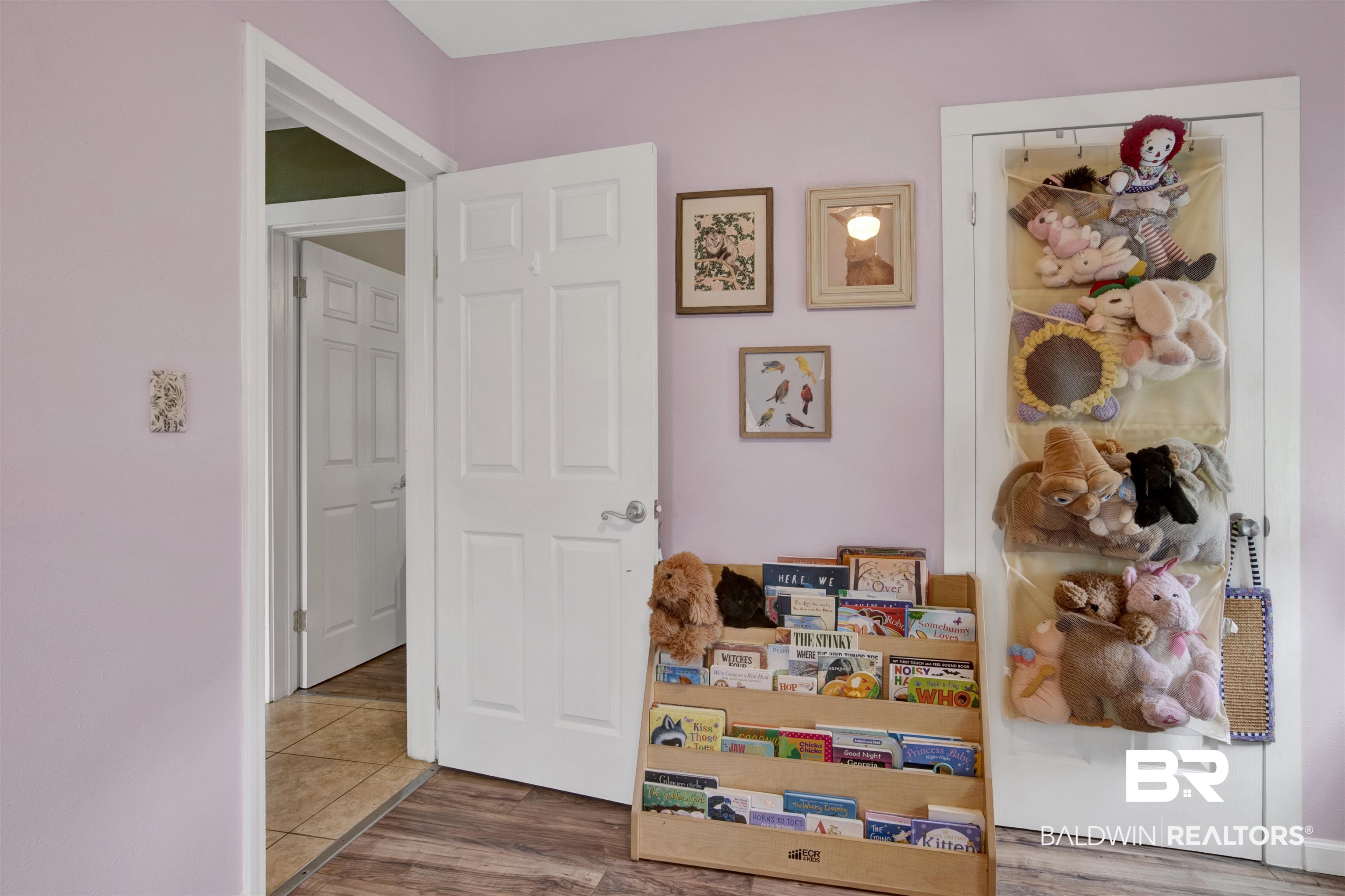 1100 North Pine Street Foley, AL 36535 - Photo 19 of 30 Interior space featuring light purple walls and wood-finish flooring