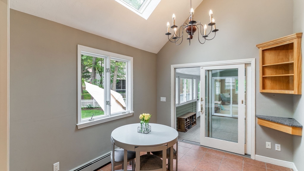 142 Baker Street Walpole, MA 02081 - Photo 12 of 42 a view of a dining room with furniture a chandelier and window