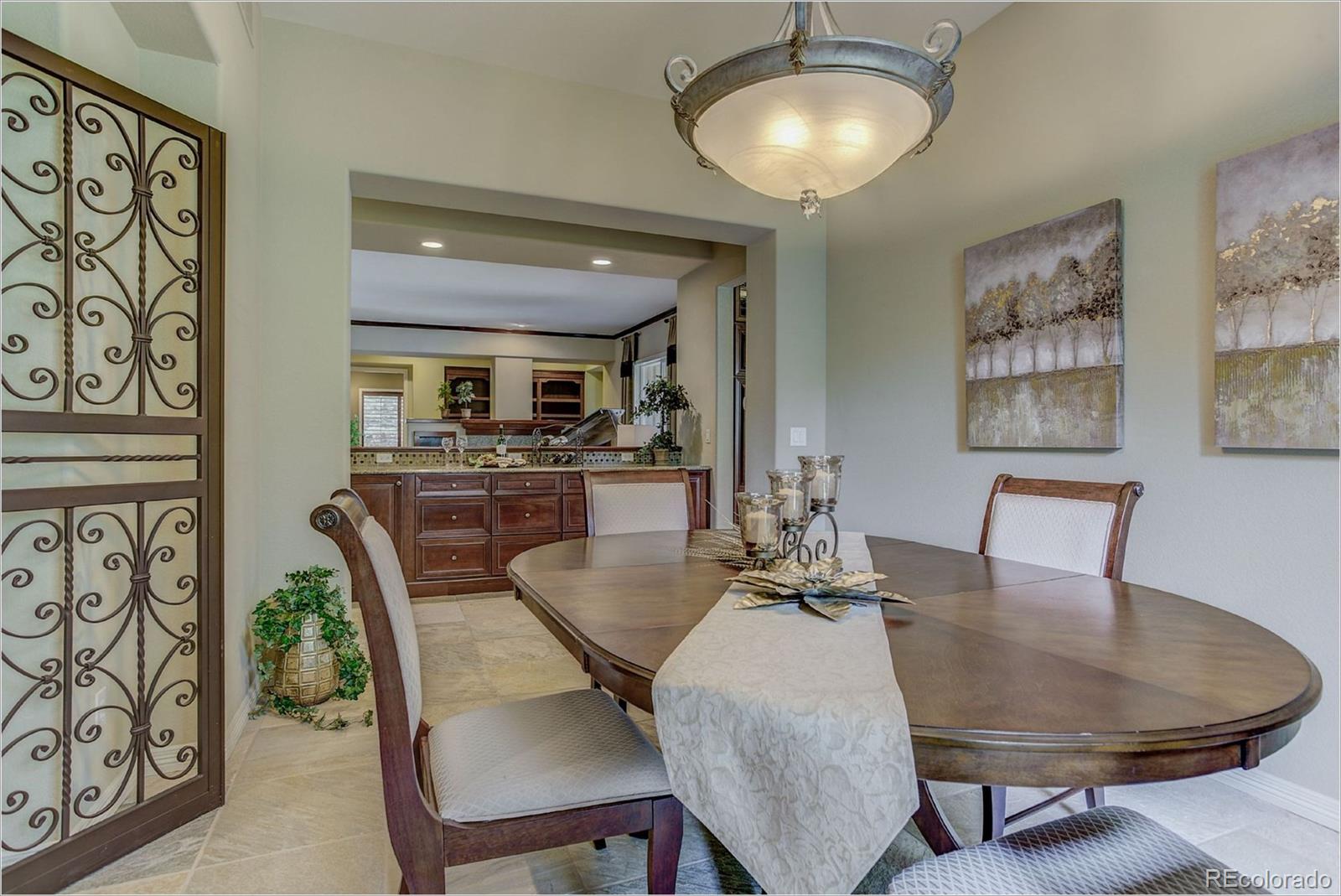 9061 Hunters Way Highlands Ranch, CO 80129 - Photo 14 of 33 a view of a dining room with furniture