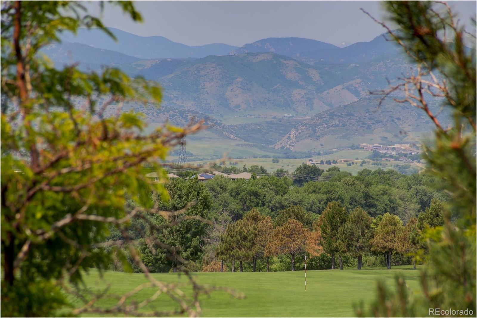 9061 Hunters Way Highlands Ranch, CO 80129 - Photo 29 of 33 a view of a yard with a mountain