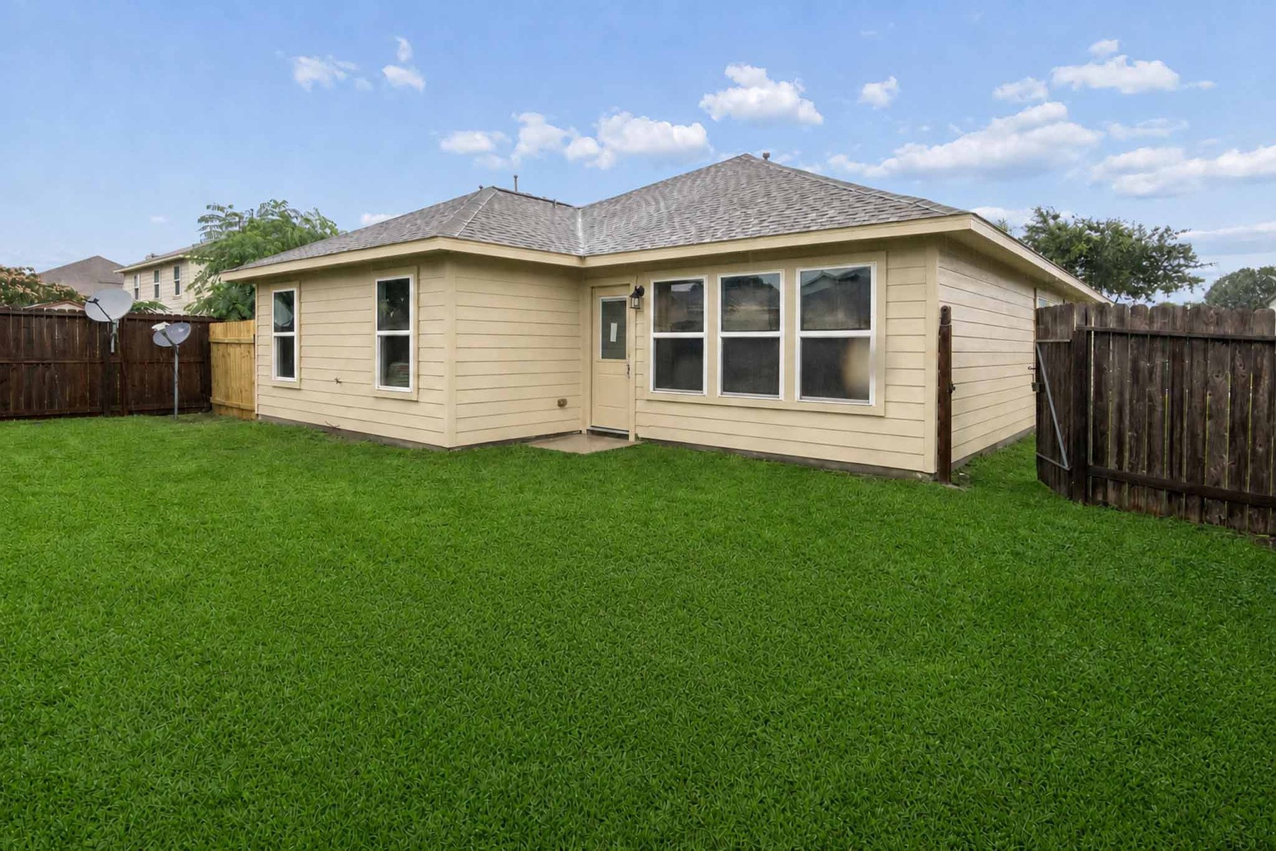 7811 Adonis Avenue Baytown, TX 77521 - Photo 36 of 36 a view of a house with a yard and sitting area