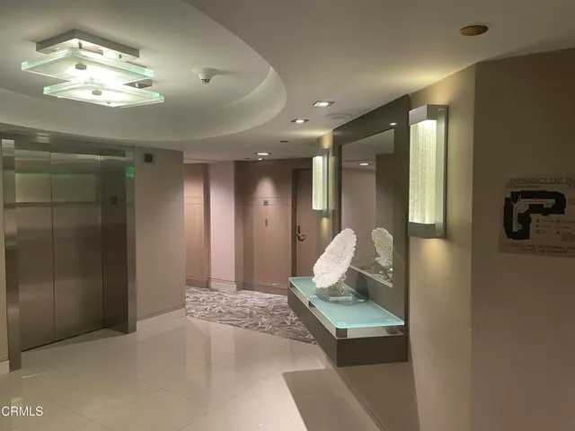 a view of a hallway with workspace