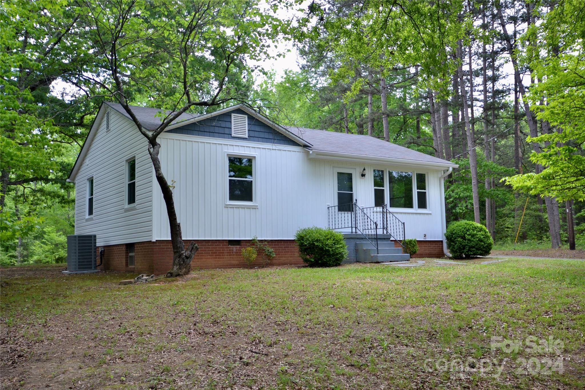 545 Kepley Road Salisbury, NC 28147 - Photo 3 of 24 a view of a house with a yard and large trees