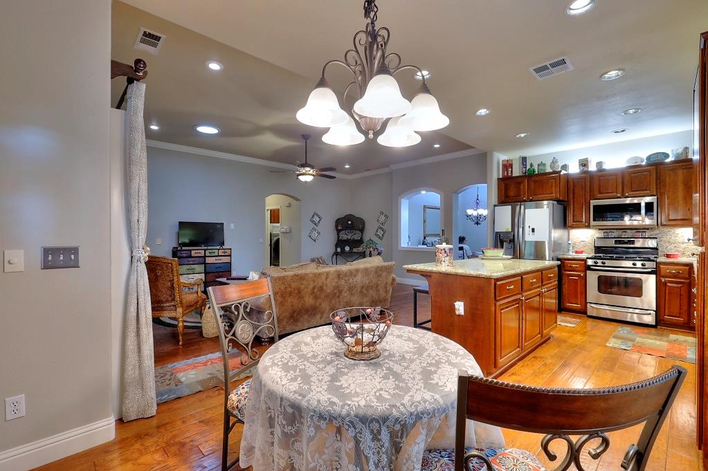 4152 Post Oak Drive Turlock, CA 95382 - Photo 35 of 71 a large kitchen with a table and chairs