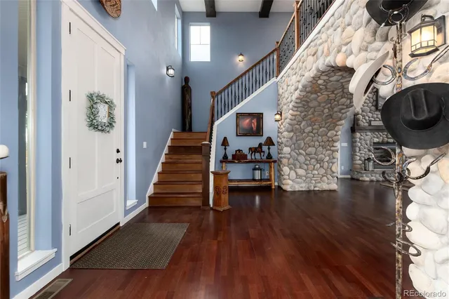 a view of entryway with wooden floor