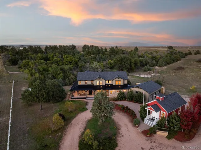an aerial view of a house with mountain view