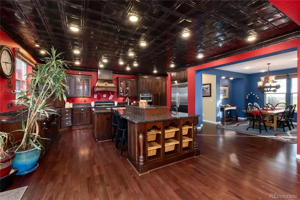 a living room with lots of furniture and kitchen view