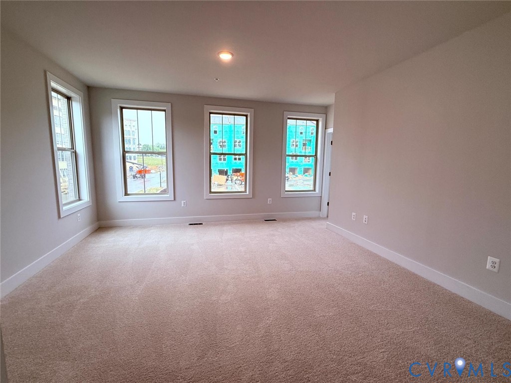 3628 Edna Path, Unit A Henrico, VA 23231 - Photo 4 of 7 Spacious carpeted room featuring multiple windows