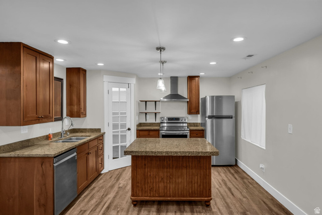 1836 West 800 North Mapleton, UT 84663 - Photo 20 of 38 Kitchen featuring stainless steel appliances, hanging light fixtures, wood finish cabinets, and dark wood-style flooring