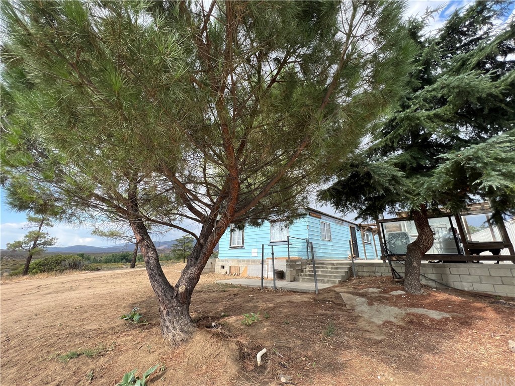 39311 Howard Road Anza, CA 92539 - Photo 19 of 23 a view of a house with a yard