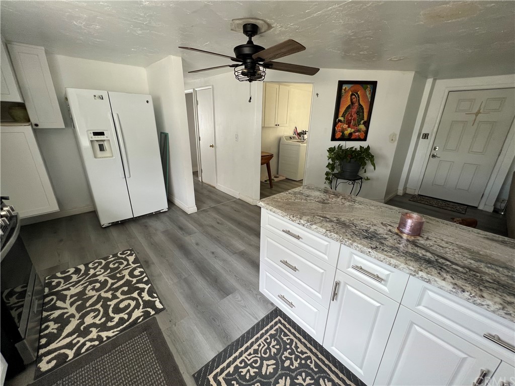 39311 Howard Road Anza, CA 92539 - Photo 6 of 23 a view of a hallway with wooden floor and staircase