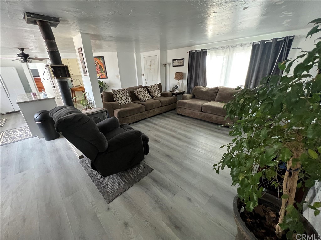 39311 Howard Road Anza, CA 92539 - Photo 7 of 23 a living room with furniture and a potted plant