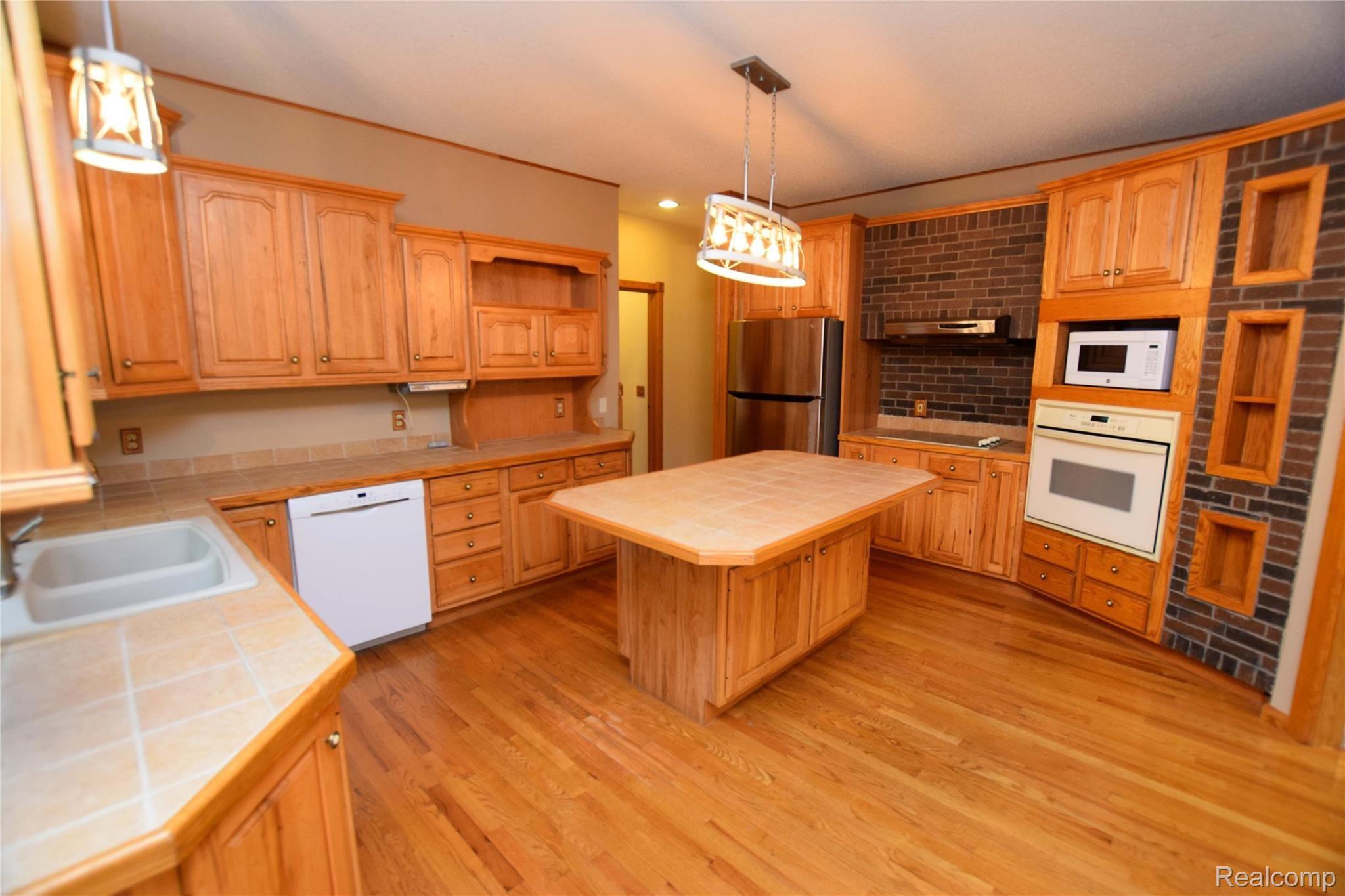12982 Ithaca Road St. Charles, MI 48655 - Photo 9 of 27 The island is a central family meeting place